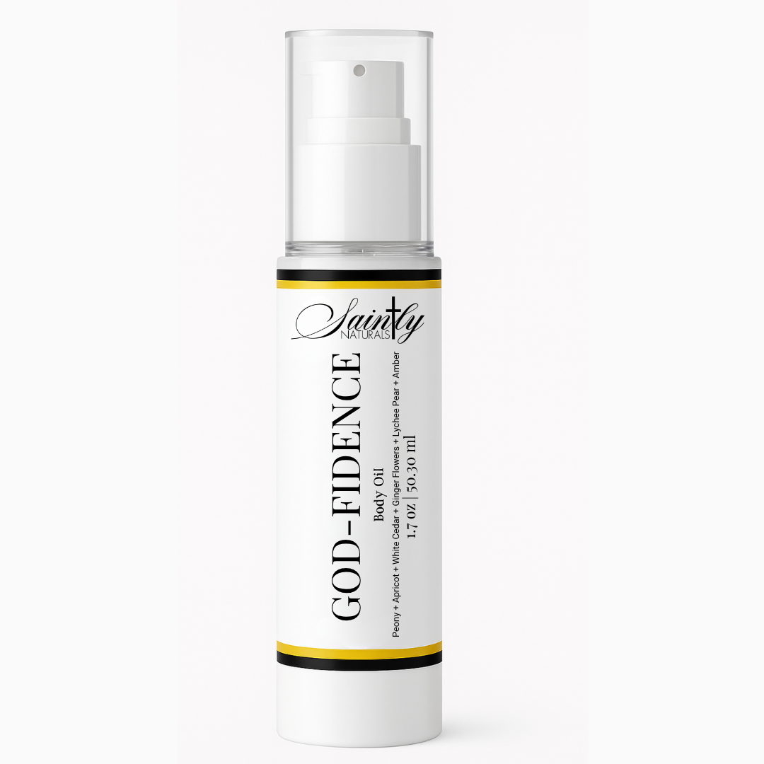 A white cylindrical pump bottle of Saintly God-fidence Body Oil with a clear cap, set against a plain white background.